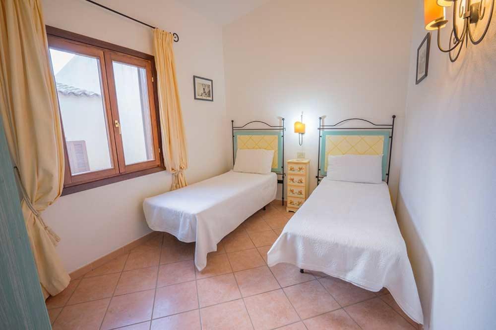טנאונלה Residence Baia Sant Anna Con Piscina מראה חיצוני תמונה